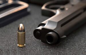 gun and bullet display - Springfield Gun Crimes and Weapon Charges Defense Lawyer Near You [Free Consultation] - Springfield Gun and Weapon Crime Defense Attorney Near Me - Lawyers That Specialize in Gun and Weapon Cases in Springfield, IL - Springfield, Illinois Firearm and Weapon Armed Offenses Lawyers - Noll Law Group