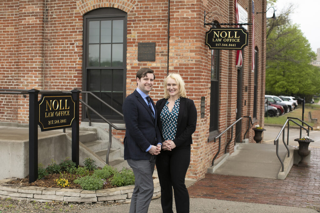 attorneys dan and sarah noll outside of Noll law office