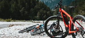 two bicycles outside on gravel road