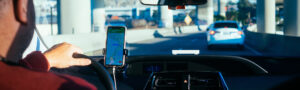 person driving car with GPS up on phone - Springfield Uber and Lyft Accidents Lawyer Near You [Free Consultation] - Springfield Rideshare Accident Attorneys Near Me - Lyft and Uber Rideshare Accident Attorney in Springfield, IL - Springfield, Illinois Lyft and Uber accident Law Firm - Lyft Car Accident and Crash Lawyer - Noll Law Office